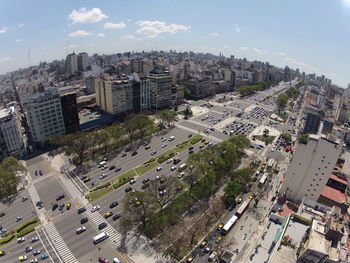 High angle view of road by buildings in city