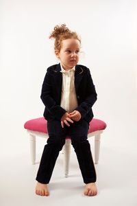 Full length of young woman over white background