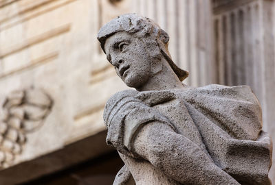 Low angle view of statue against building