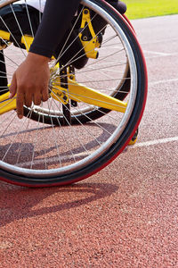 Low section of man on bicycle