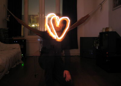 Low angle view of illuminated text at night