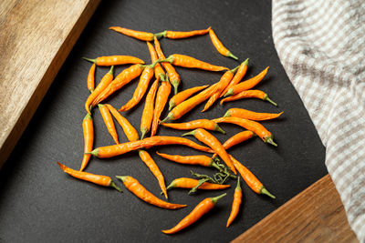 High angle view of orange leaf on table