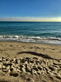 Scenic view of beach against sky