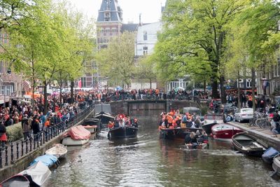 Boats in canal along buildings