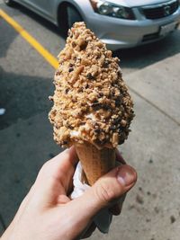 Midsection of person holding ice cream cone