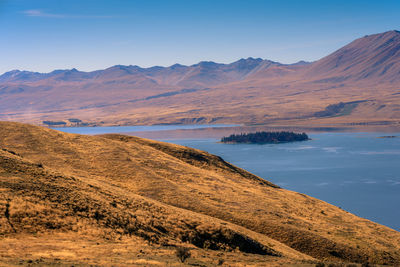 Scenic view of landscape and mountains against sky