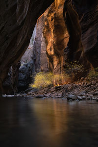 View of river flowing amidst canyon