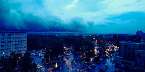 High angle view of illuminated city buildings at night