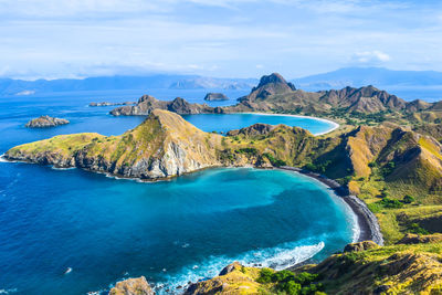 Panoramic view of sea and mountains against sky