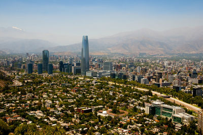 High angle view of buildings in city against sky