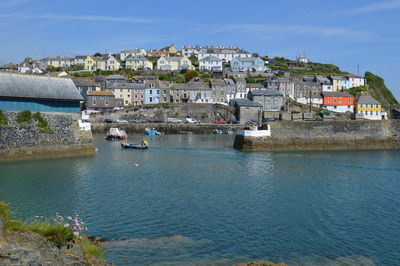 Townscape by sea against sky