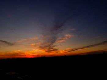 Scenic view of silhouette landscape against sky during sunset