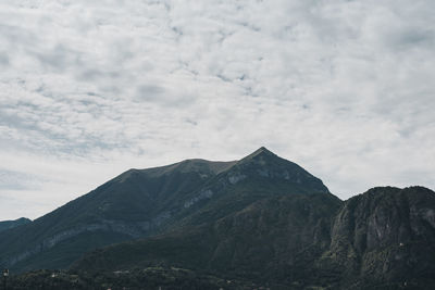 Scenic view of mountains against cloudy sky