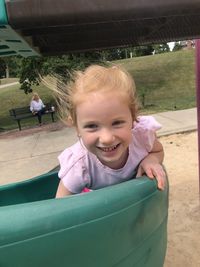Portrait of a smiling girl playing