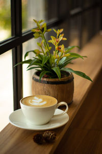 Close-up of coffee cup on table