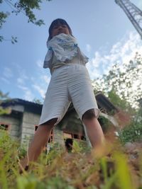 Woman standing against the sky