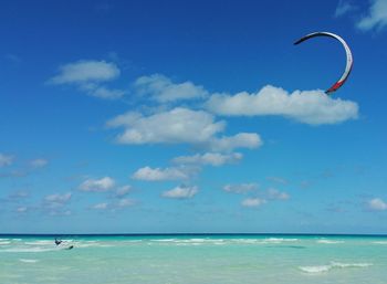 Scenic view of sea against cloudy sky