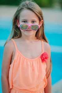 Portrait of a girl standing in swimming pool