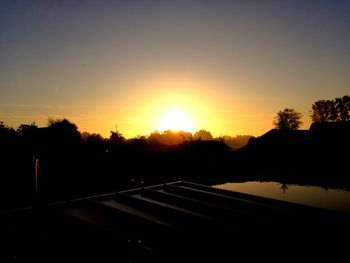 Scenic view of silhouette mountains against sky during sunset