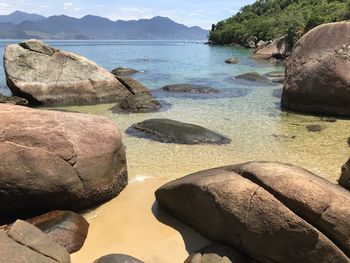 Rocks by sea against sky on ilha grande rio de janeiro 