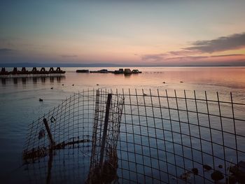 Scenic view of sea against sky at sunset
