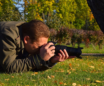 Man relaxing on grassy field