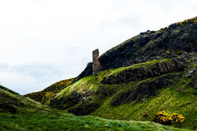 Low angle view of fort on mountain against sky