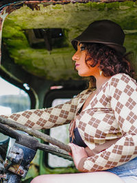 Side view of young woman looking away