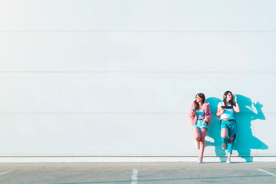 Group of people against wall