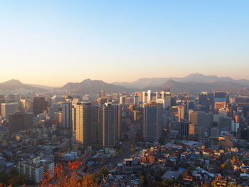 Modern buildings in city against clear sky