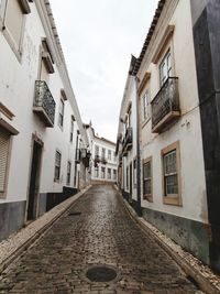 Narrow alley amidst residential buildings