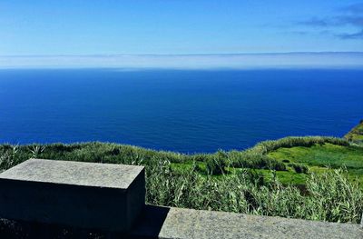 Scenic view of sea against clear blue sky