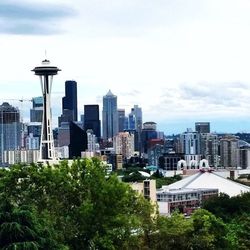 City skyline against cloudy sky