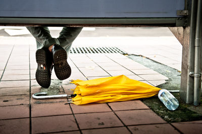 Low section of woman standing on tiled floor