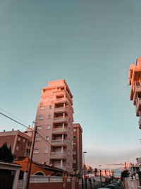 Low angle view of buildings against clear sky