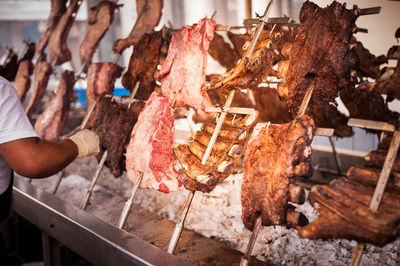 High angle view of meat on barbecue grill