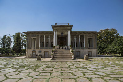 Facade of historic building against clear blue sky