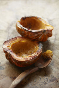 Baked acorn squash on tin with spoon
