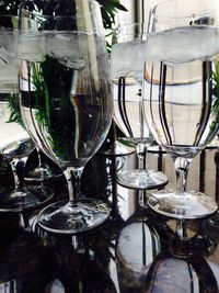 Close-up of wine glasses on table in restaurant