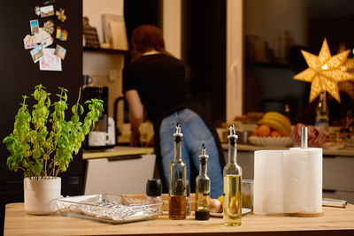 Rear view of woman holding christmas tree