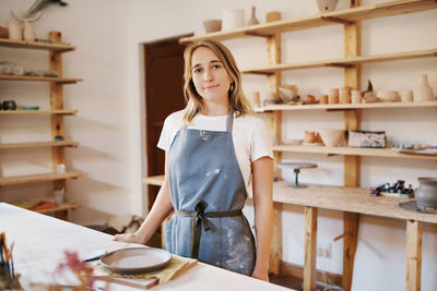 Portrait of potter in workshop