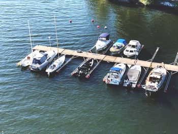 High angle view of sailboats moored in sea