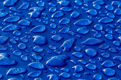 Water drops on blue textile