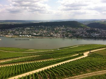 Rural landscape against cloudy sky