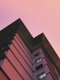 Low angle view of building against sky during sunset