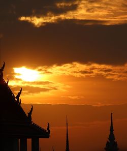 Low angle view of statue at sunset