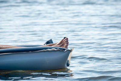 Low section of man on boat in sea