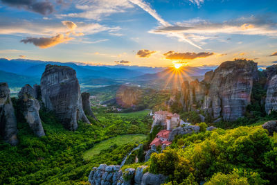 Panoramic view of rocks against sky during sunset