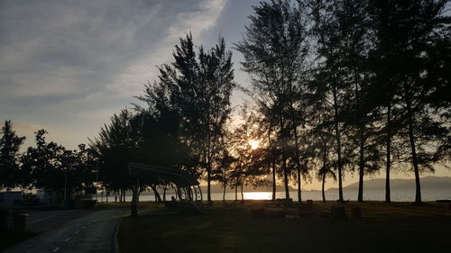 Scenic view of landscape against sky at sunset