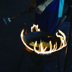 Close-up of illuminated man at night
